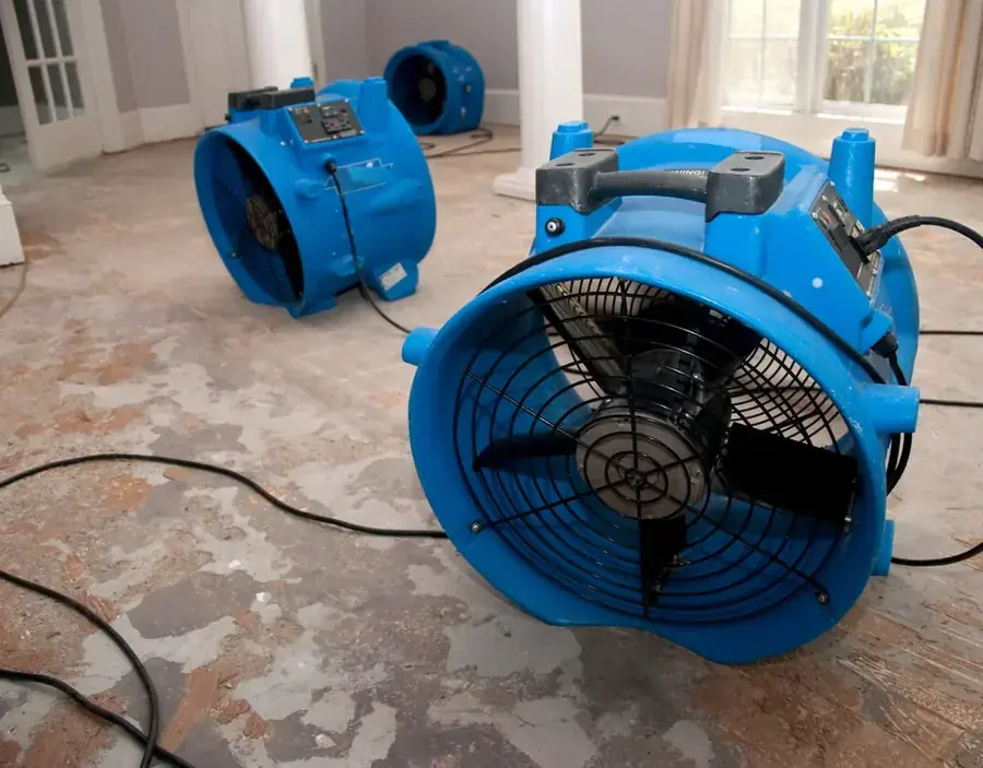 A high-volume air mover running on a floor in a Peoria, AZ home
