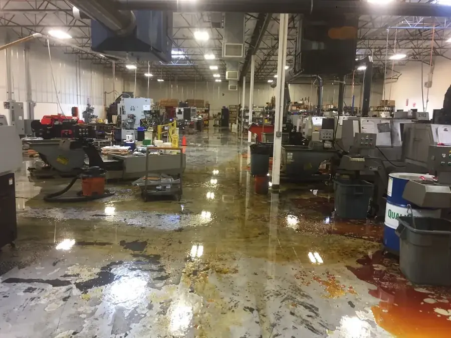 Restoration technician drying a flooded Peoria, AZ home with air movers
